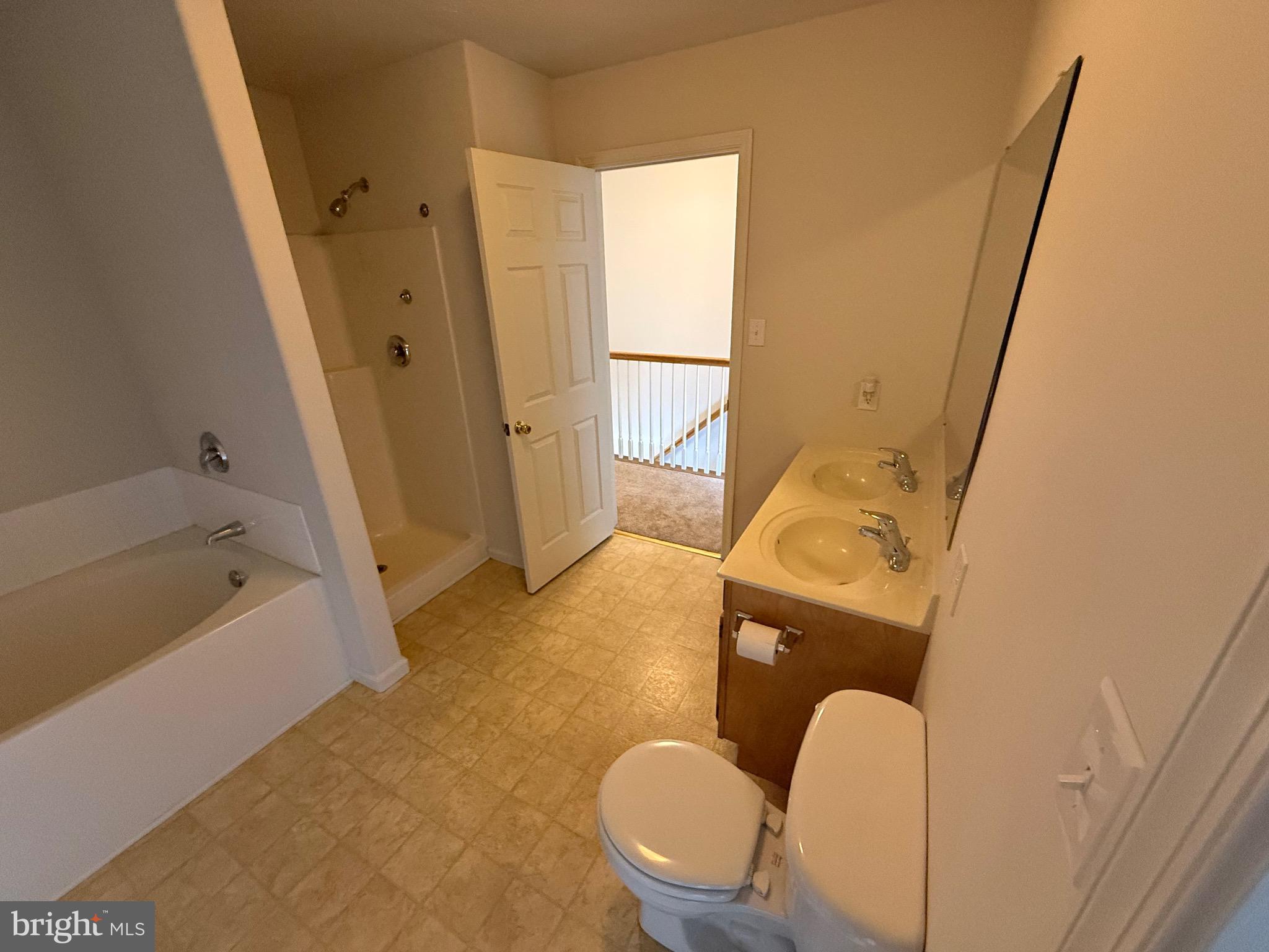 294 Mike Drive Elkton, MD 21921 - Photo 35 of 61 a bathroom with a tub sink and mirror
