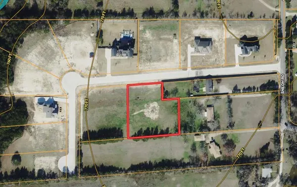 an aerial view of a house with outdoor space