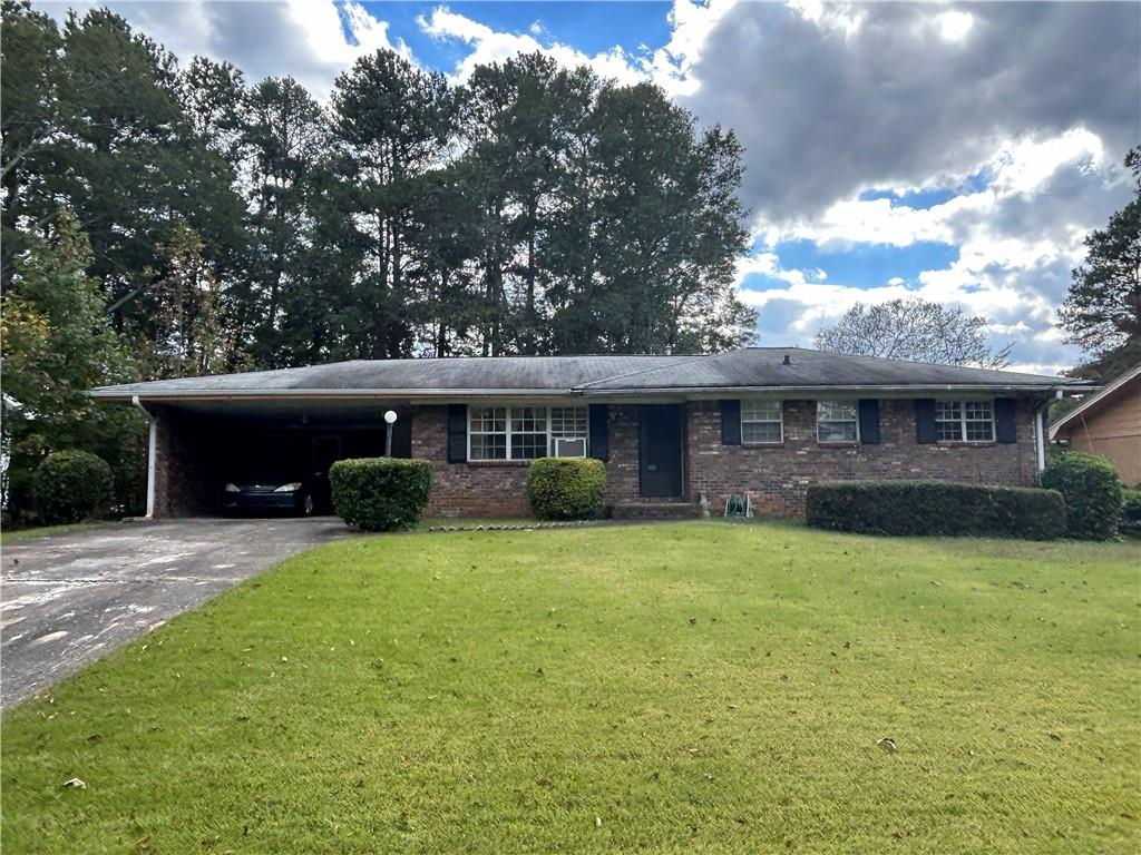 4129 Tiffany Drive Decatur, GA 30035 - Photo 1 of 1 a front view of a house with a garden