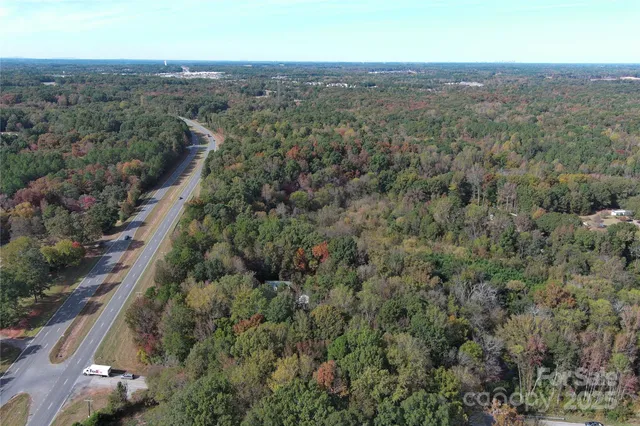 a view of a house with a tree