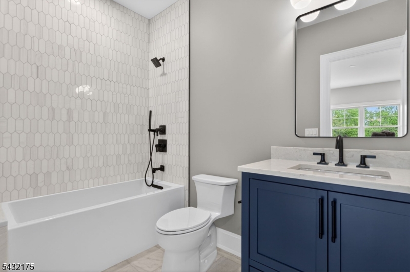 2 Ravinn Lane Warren, NJ 07059 - Photo 17 of 32 a bathroom with a sink a toilet and shower