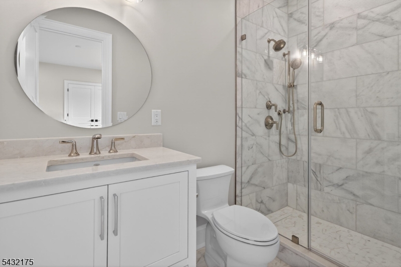 2 Ravinn Lane Warren, NJ 07059 - Photo 18 of 32 a bathroom with a toilet sink vanity granite and shower