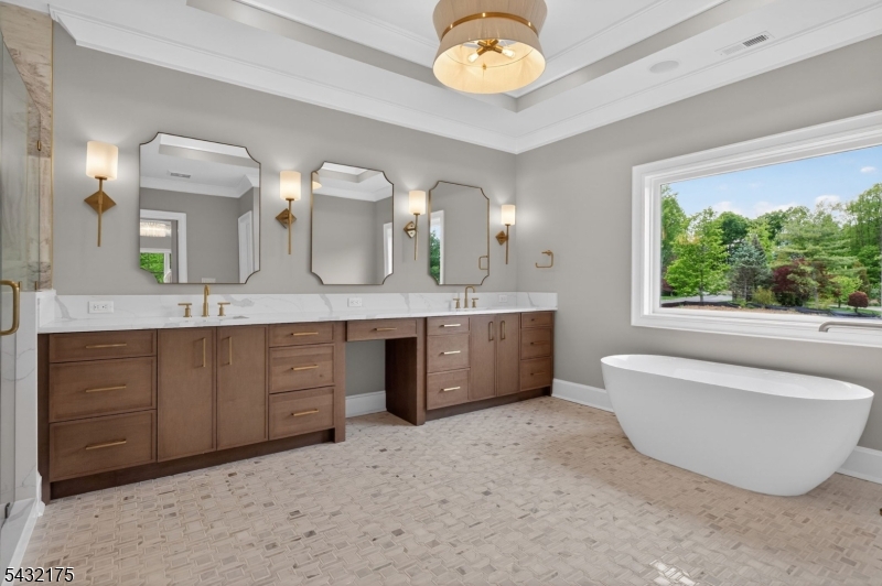 2 Ravinn Lane Warren, NJ 07059 - Photo 20 of 32 a spacious bathroom with a tub double sink and a large mirror