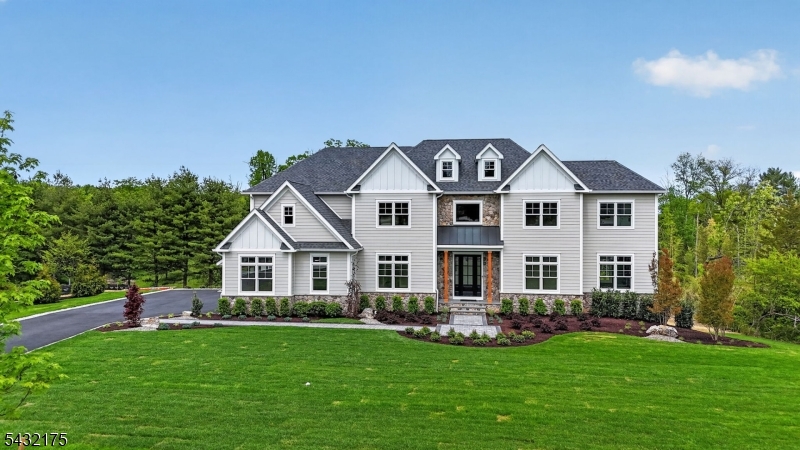 2 Ravinn Lane Warren, NJ 07059 - Photo 2 of 32 a front view of a house with a garden and yard