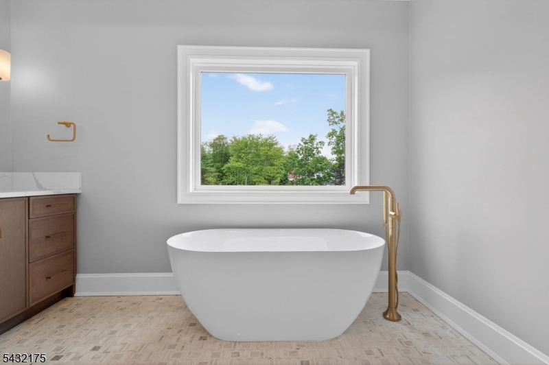 2 Ravinn Lane Warren, NJ 07059 - Photo 23 of 32 a white bath tub sitting in a bathroom