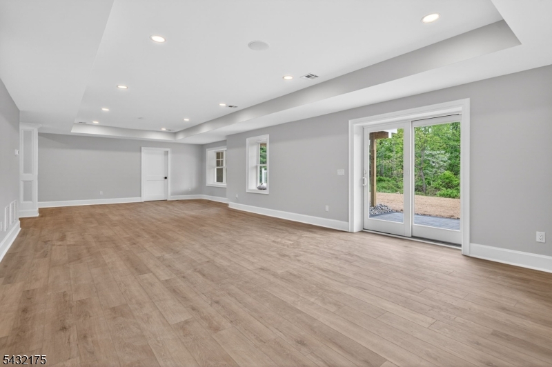 2 Ravinn Lane Warren, NJ 07059 - Photo 24 of 32 a view of an empty room with wooden floor and a window