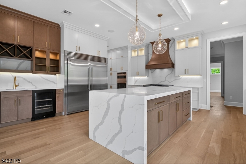 2 Ravinn Lane Warren, NJ 07059 - Photo 4 of 32 a kitchen with stainless steel appliances granite countertop a sink a stove and a refrigerator