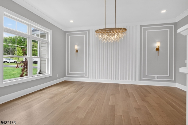 2 Ravinn Lane Warren, NJ 07059 - Photo 9 of 32 a view of an empty room with wooden floor and a window