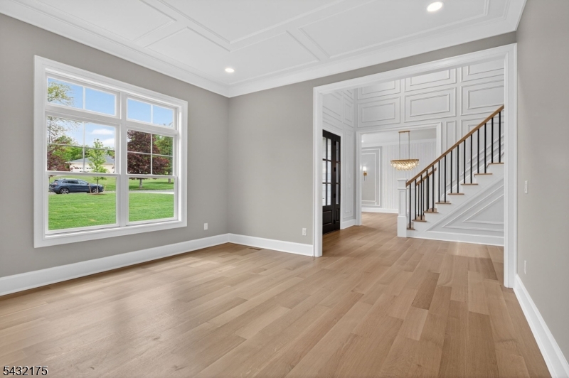 2 Ravinn Lane Warren, NJ 07059 - Photo 10 of 32 a view of an empty room with wooden floor and a window