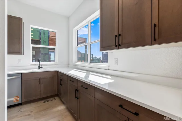 a kitchen with a sink and cabinets