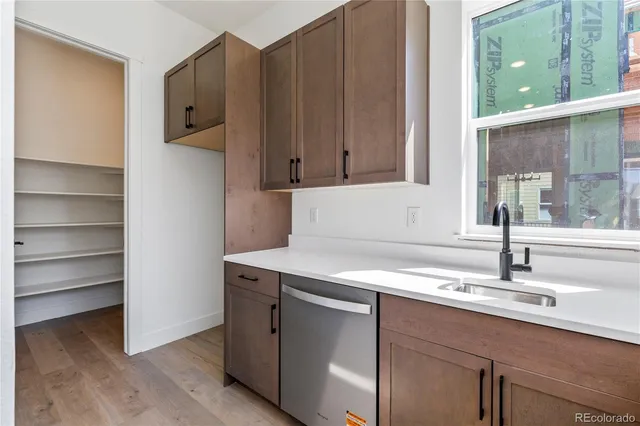 a kitchen with a sink and a window