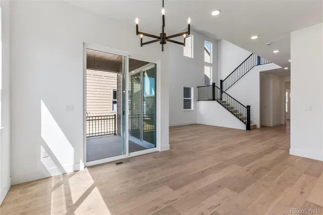 a view of an entryway with a floor to ceiling window and stairs