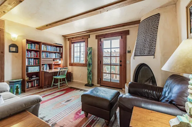 a dining room with furniture window and wooden floor