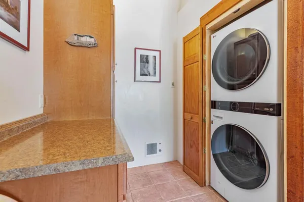 a view of a hallway with washer and dryer
