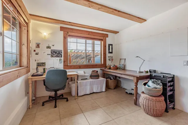a view of a chair and table in the balcony