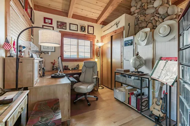 a view of a balcony with mountain view and wooden floor