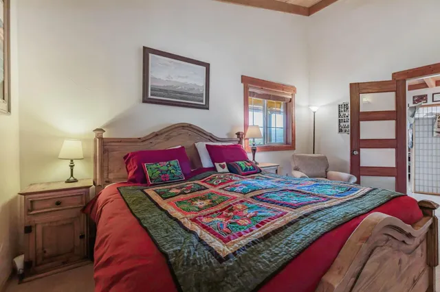 a view of a house with backyard porch and sitting area