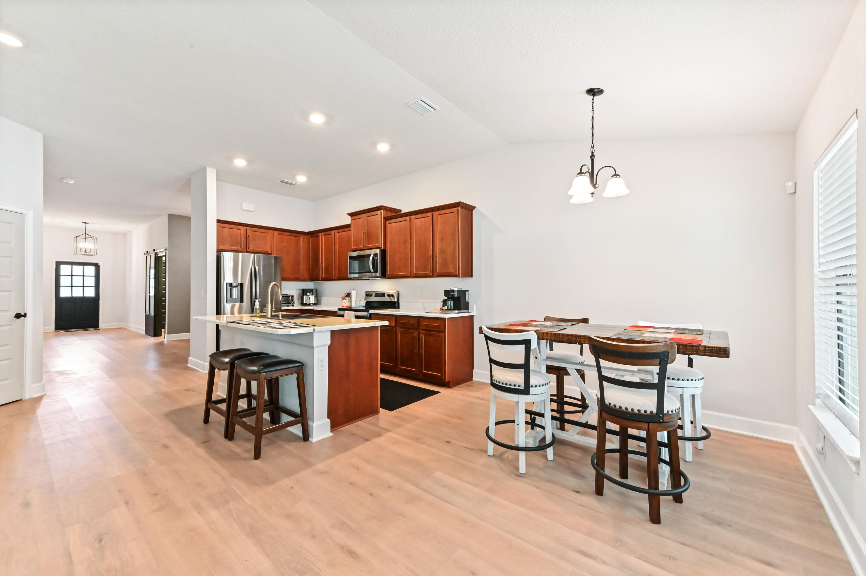 5352 Lugo Street Fort Pierce, FL 34951 - Photo 14 of 44 a view of a dining room with furniture and wooden floor