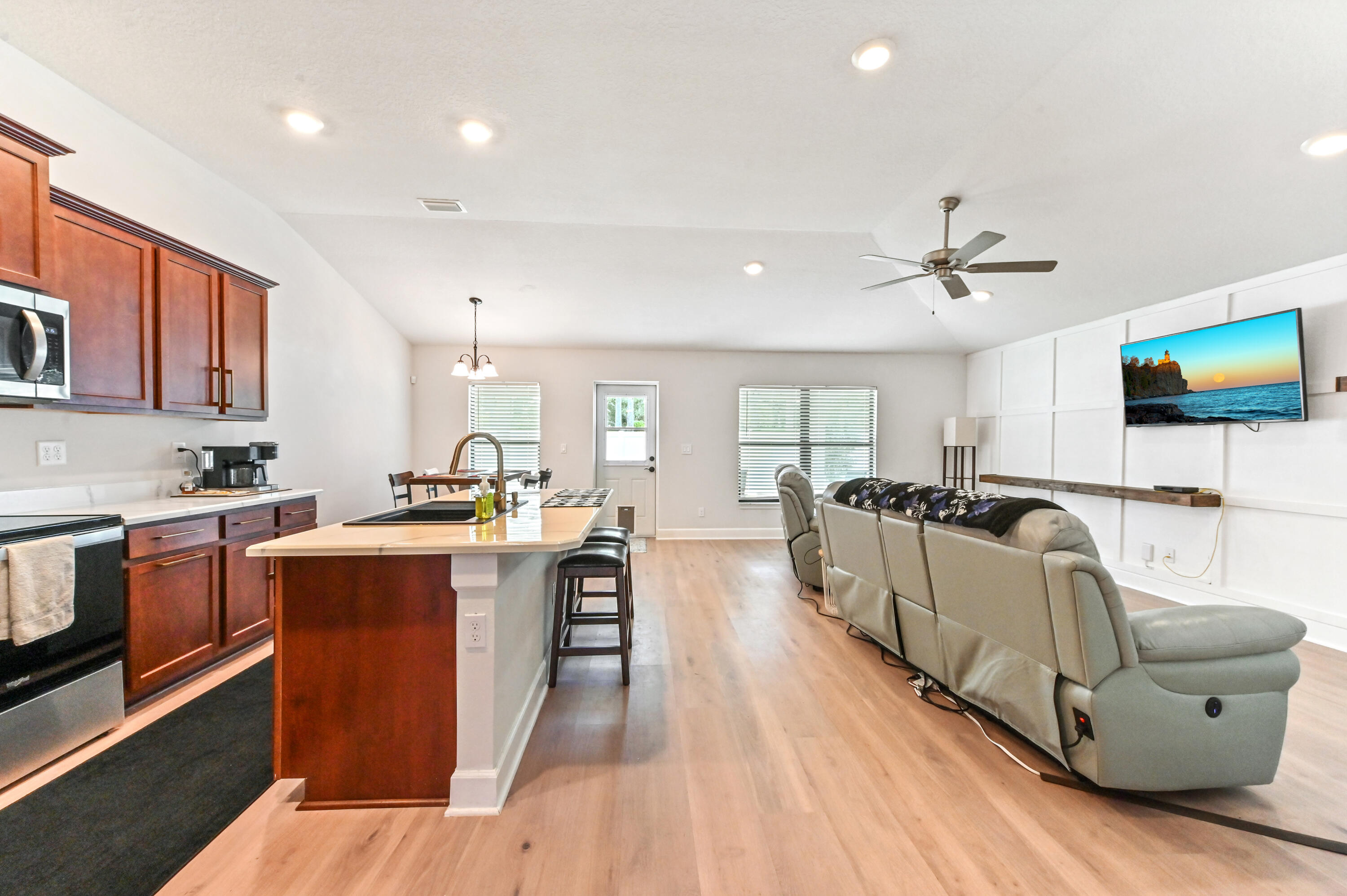 5352 Lugo Street Fort Pierce, FL 34951 - Photo 17 of 44 a living room with stainless steel appliances furniture and a kitchen view