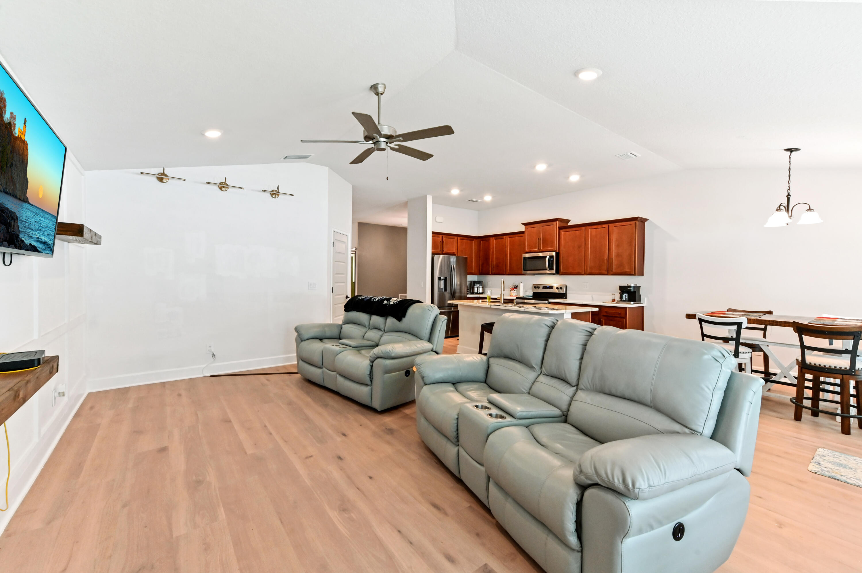 5352 Lugo Street Fort Pierce, FL 34951 - Photo 19 of 44 a living room with furniture kitchen view and a flat screen tv