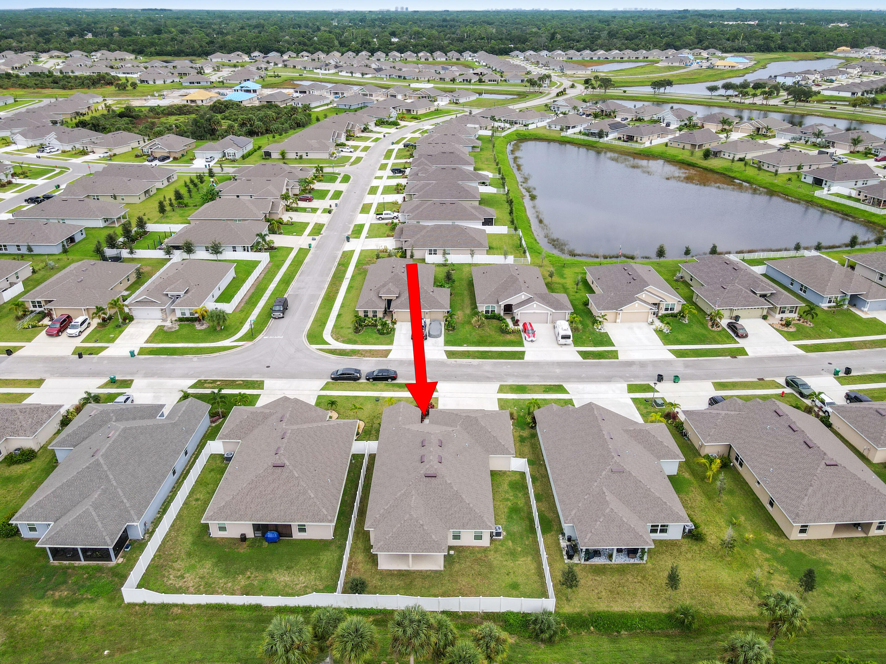 5352 Lugo Street Fort Pierce, FL 34951 - Photo 2 of 44 an aerial view of residential houses with outdoor space and parking