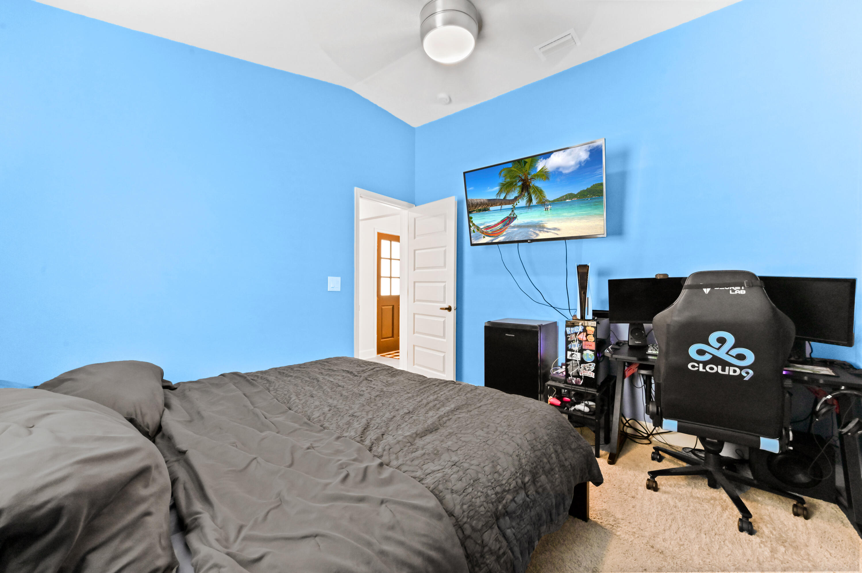 5352 Lugo Street Fort Pierce, FL 34951 - Photo 25 of 44 a bedroom with a bed and a fireplace