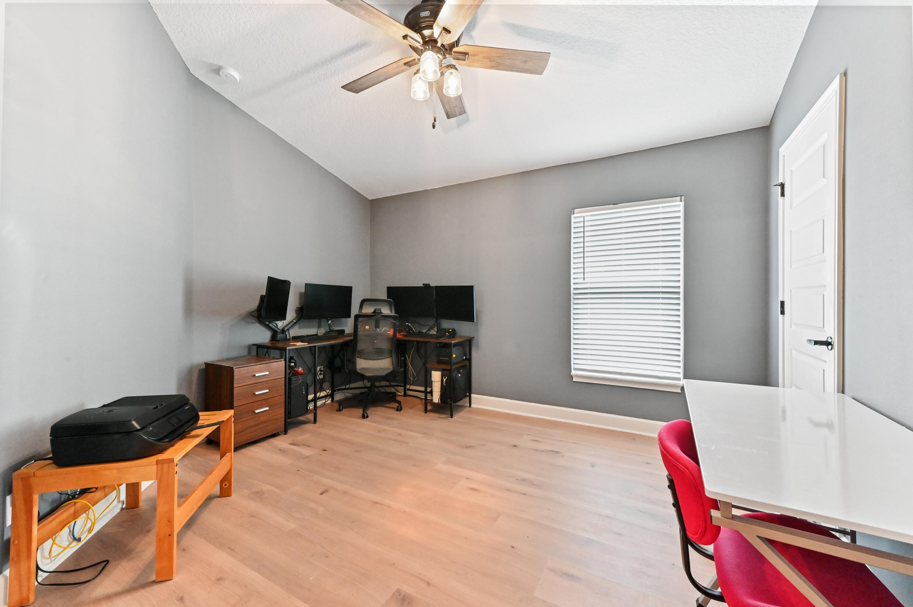 5352 Lugo Street Fort Pierce, FL 34951 - Photo 27 of 44 a view of a workspace with furniture and a window