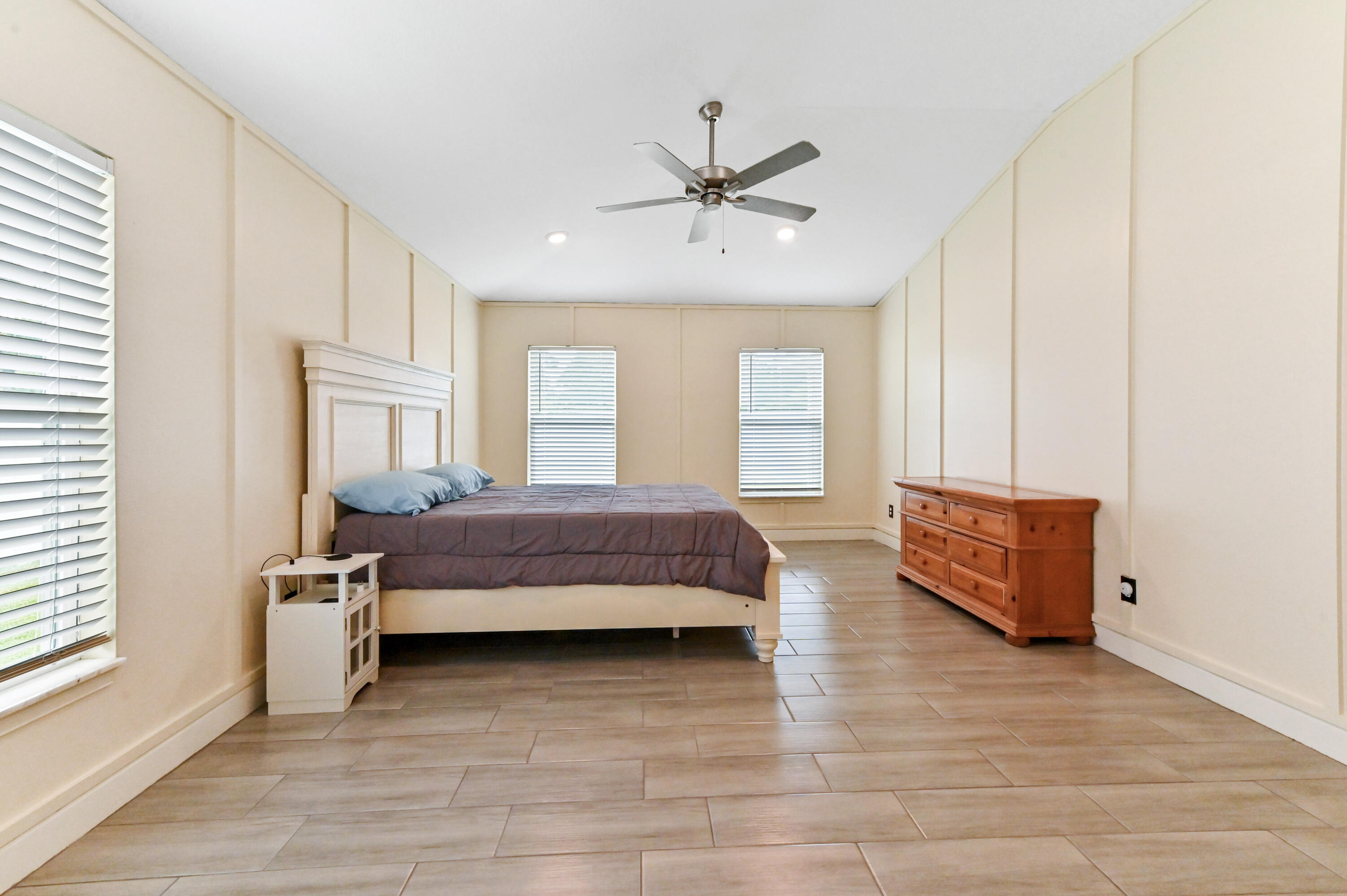 5352 Lugo Street Fort Pierce, FL 34951 - Photo 29 of 44 a spacious bedroom with a bed and window