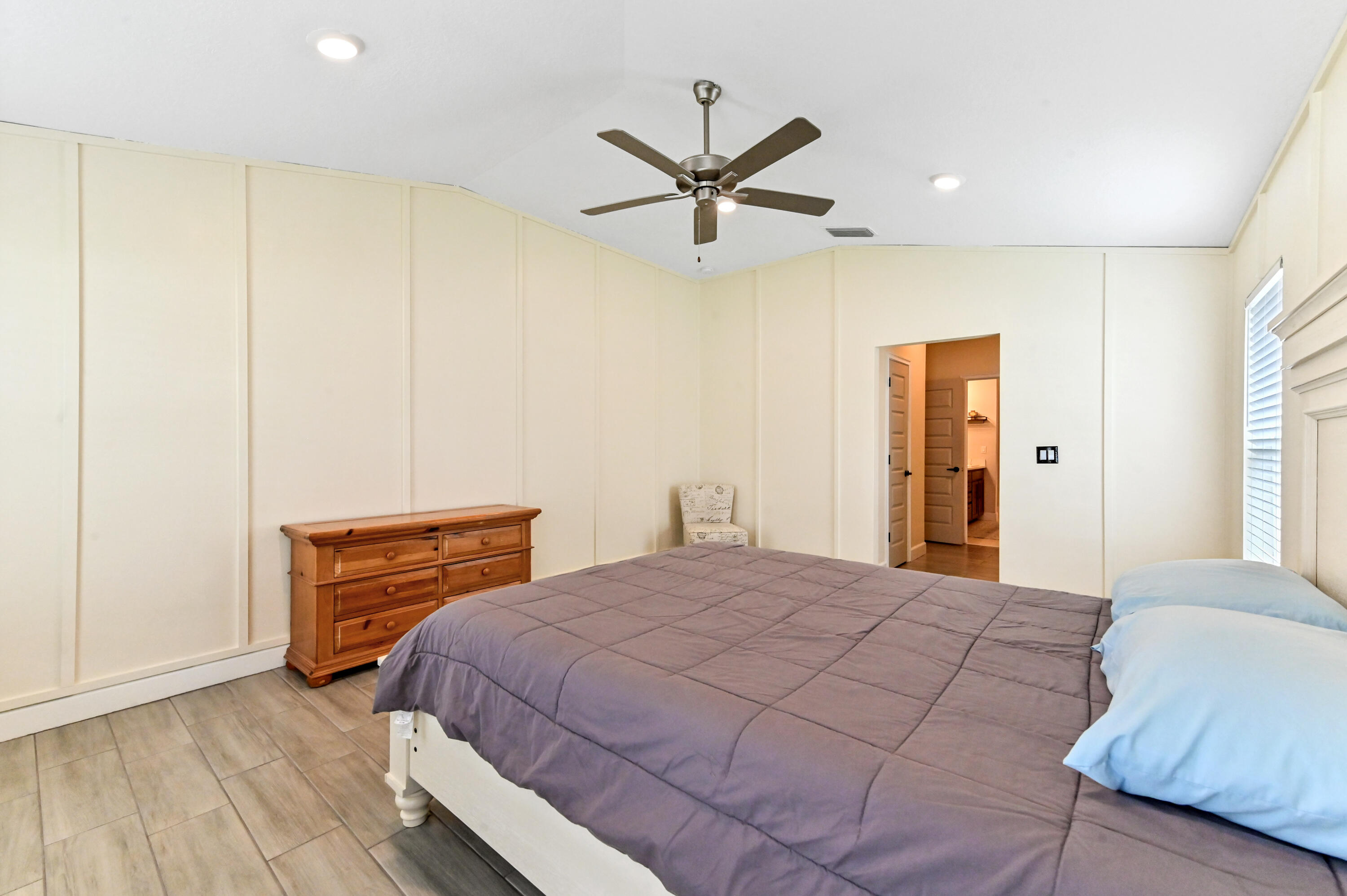 5352 Lugo Street Fort Pierce, FL 34951 - Photo 31 of 44 a bedroom with a bed and wooden floor