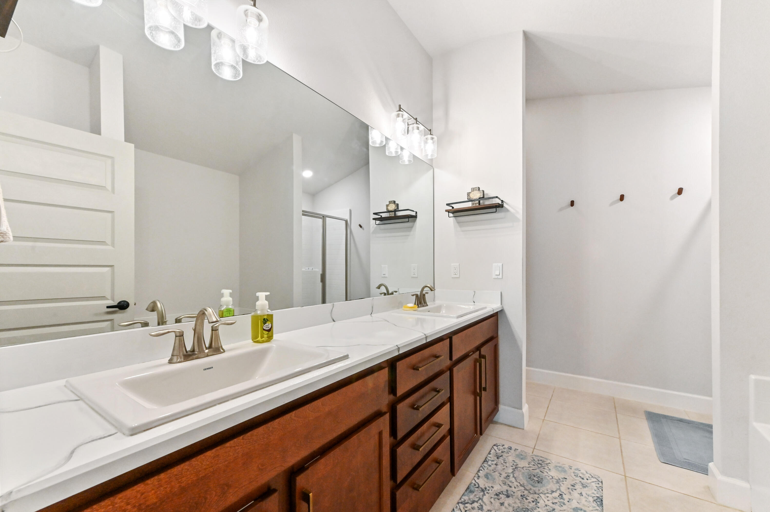 5352 Lugo Street Fort Pierce, FL 34951 - Photo 34 of 44 a bathroom with a sink a vanity and a mirror