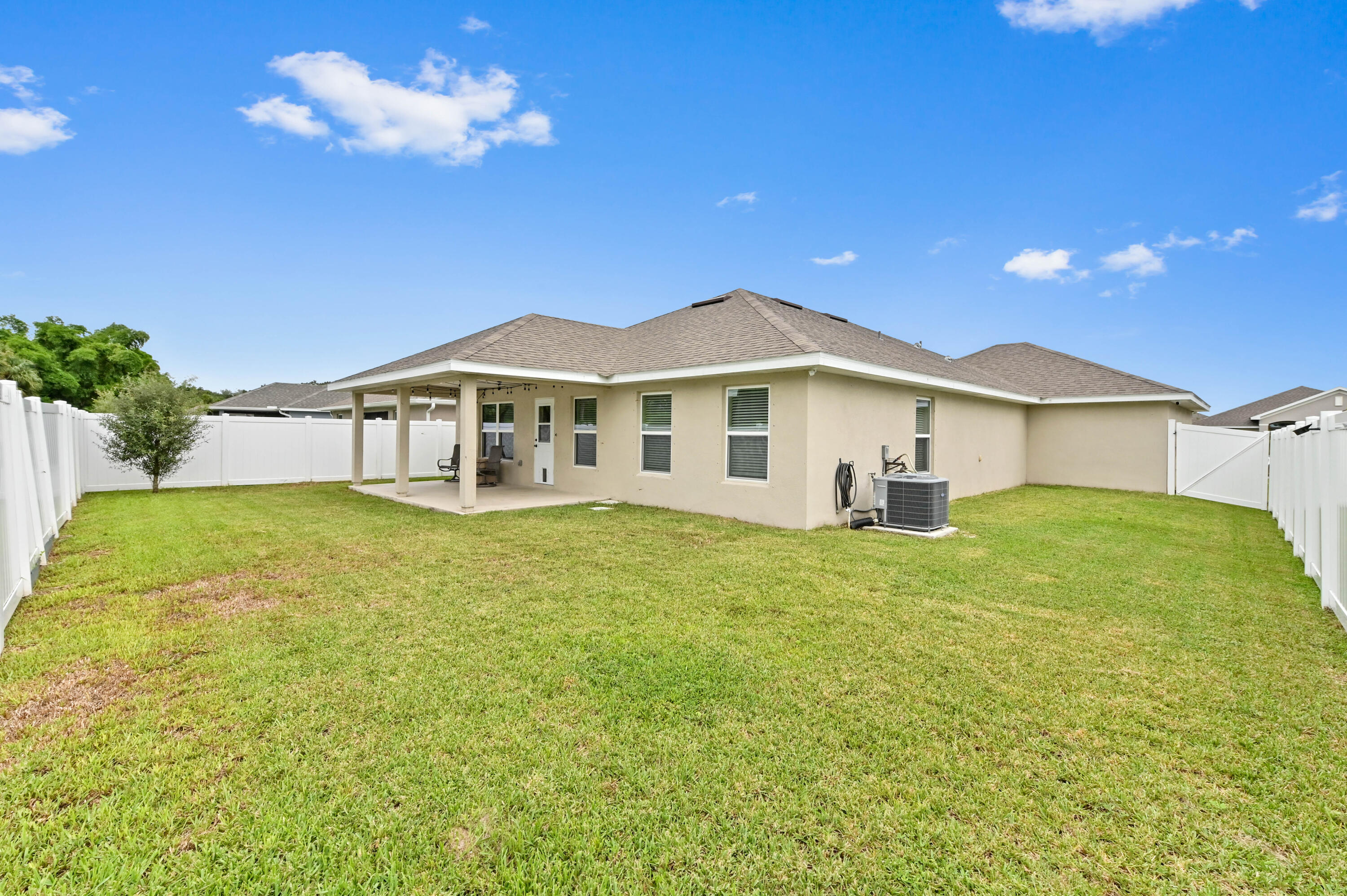 5352 Lugo Street Fort Pierce, FL 34951 - Photo 39 of 44 a view of a house with a big yard
