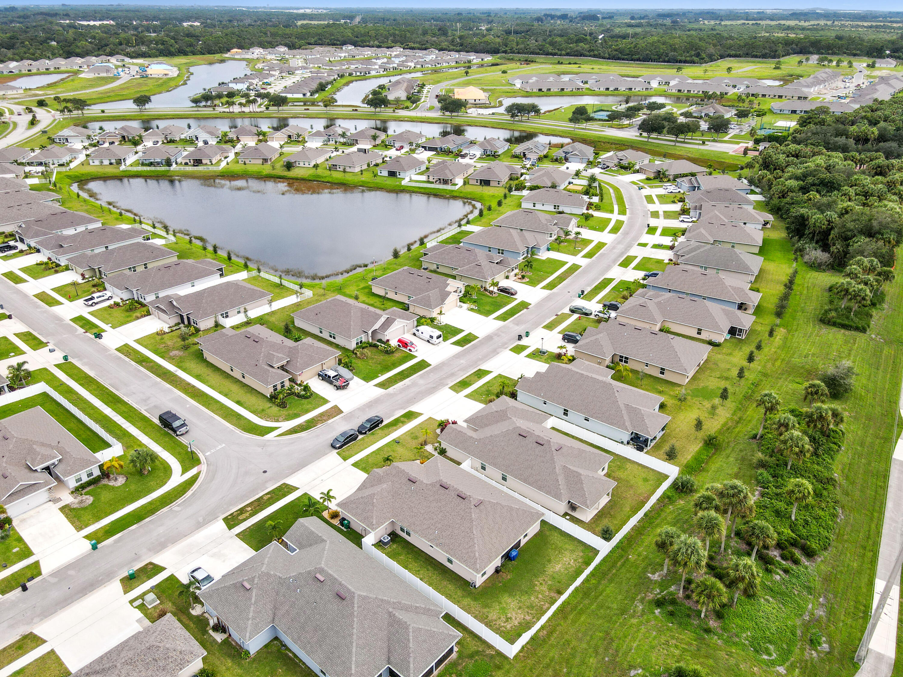 5352 Lugo Street Fort Pierce, FL 34951 - Photo 40 of 44 an aerial view of residential houses with outdoor space