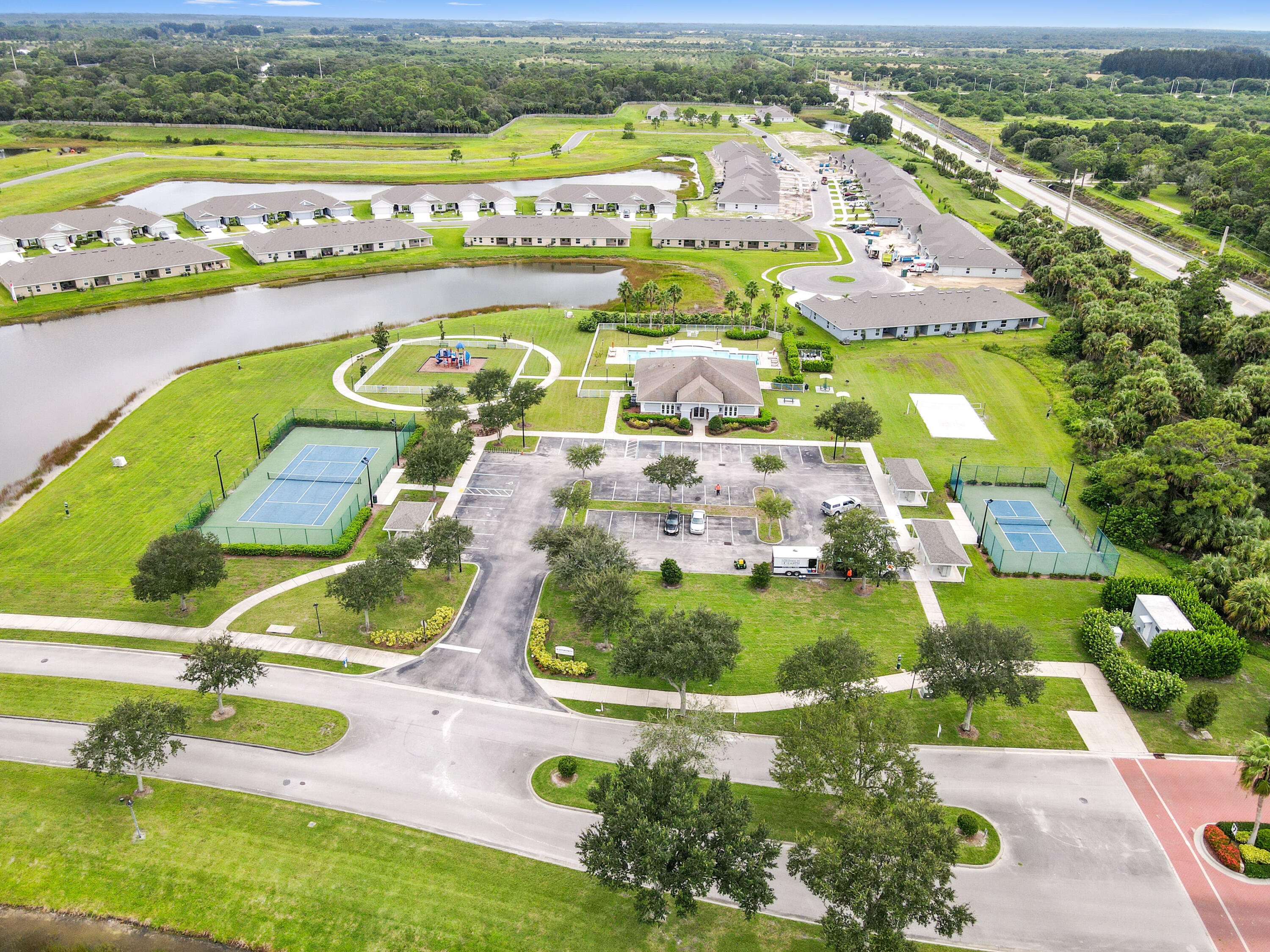 5352 Lugo Street Fort Pierce, FL 34951 - Photo 41 of 44 an aerial view of residential houses with outdoor space and city view