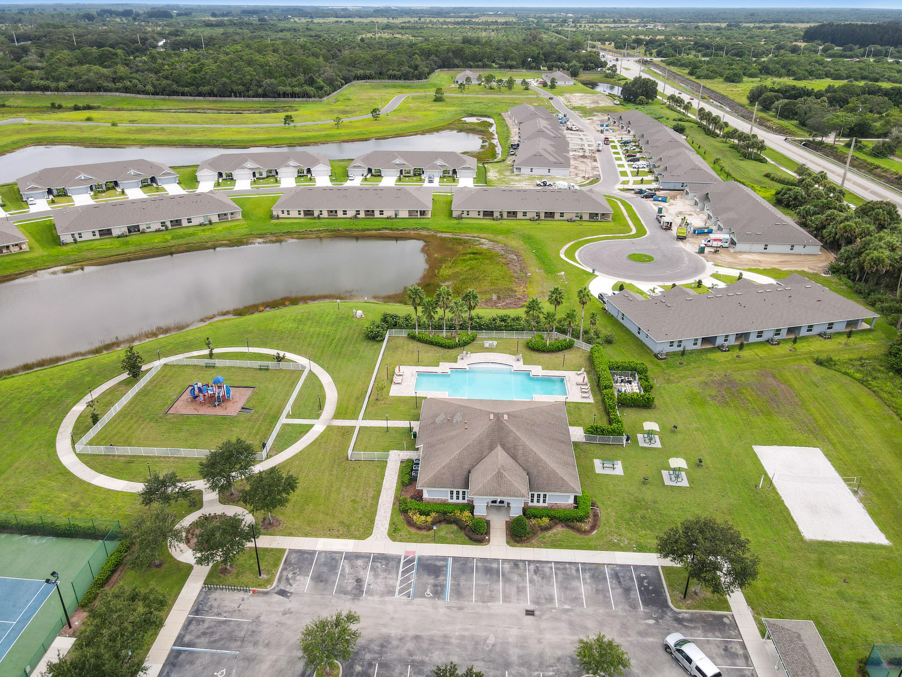 5352 Lugo Street Fort Pierce, FL 34951 - Photo 42 of 44 an aerial view of a pool residential houses with outdoor space