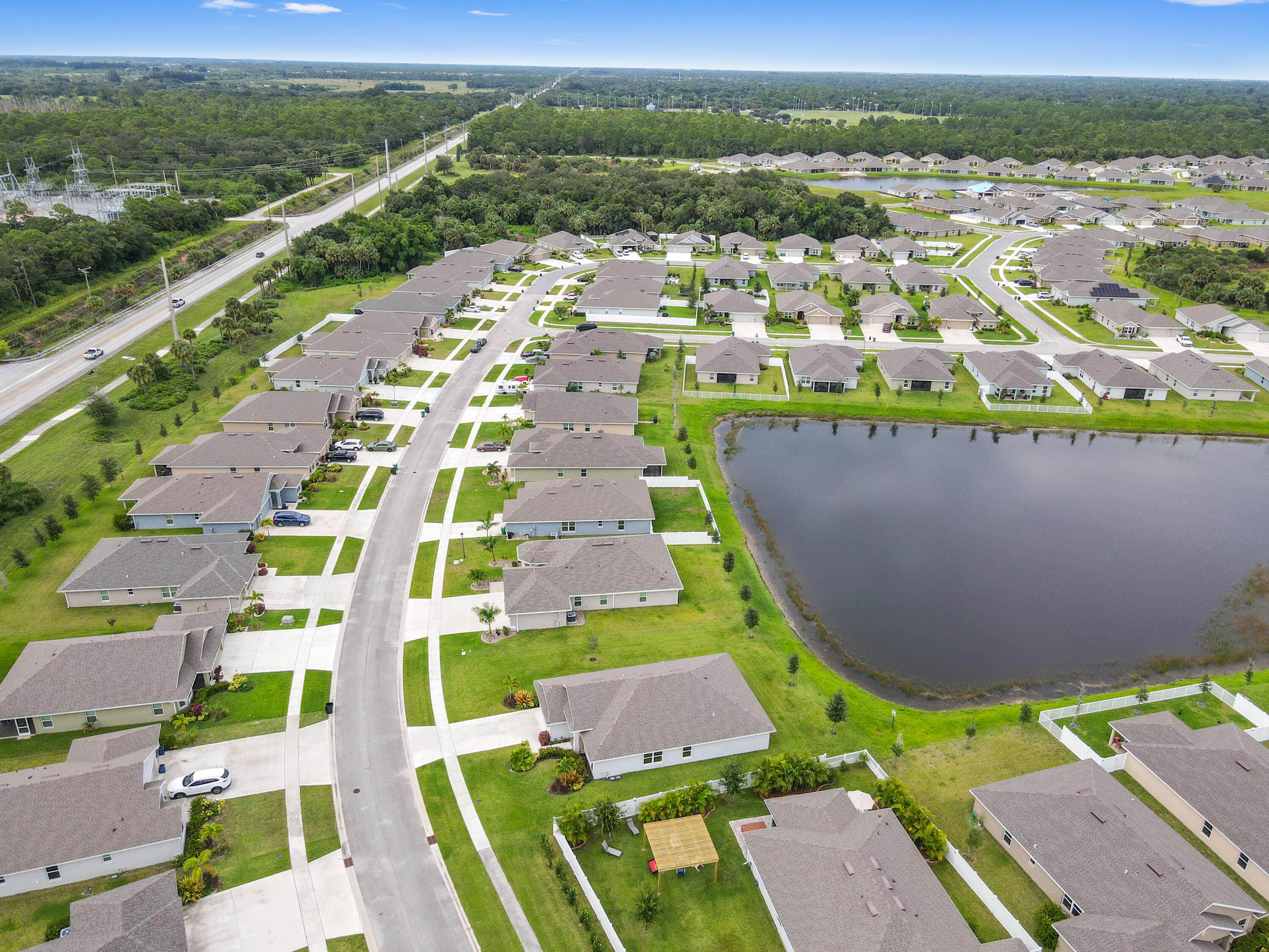 5352 Lugo Street Fort Pierce, FL 34951 - Photo 44 of 44 an aerial view of multiple houses with a swimming pool