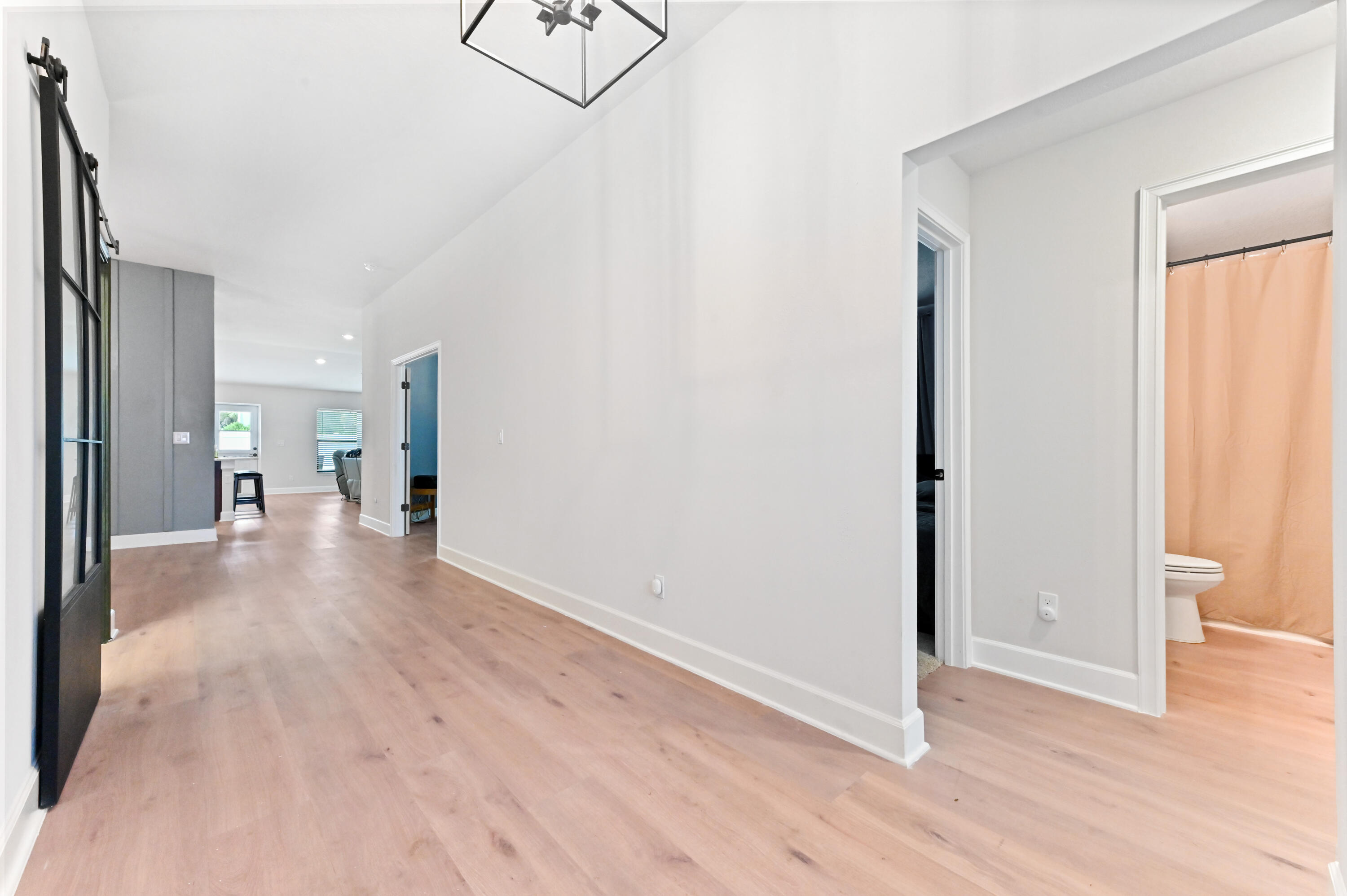 5352 Lugo Street Fort Pierce, FL 34951 - Photo 7 of 44 a view of a hallway with wooden floor