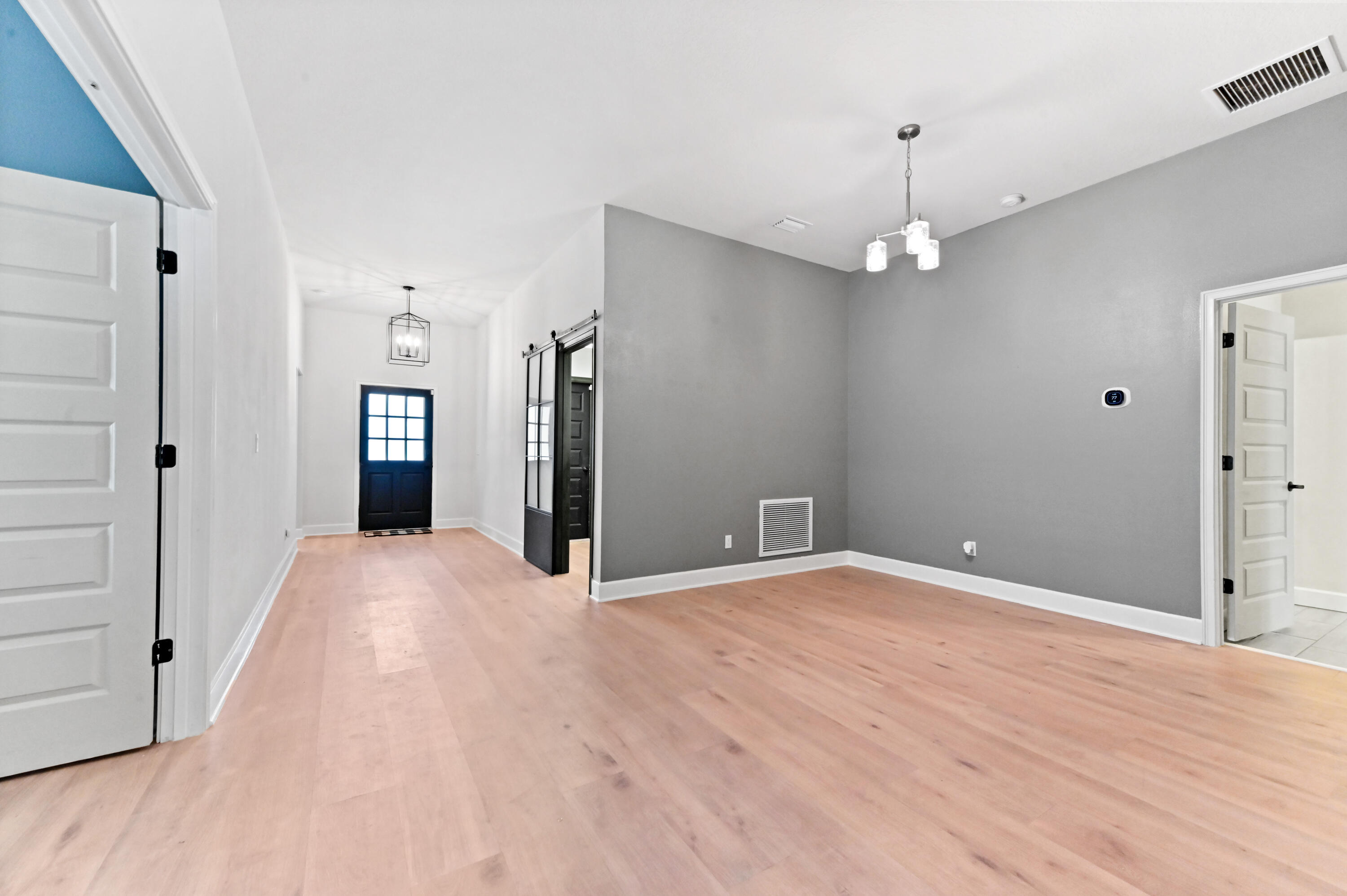 5352 Lugo Street Fort Pierce, FL 34951 - Photo 9 of 44 a view of an empty room with wooden floor
