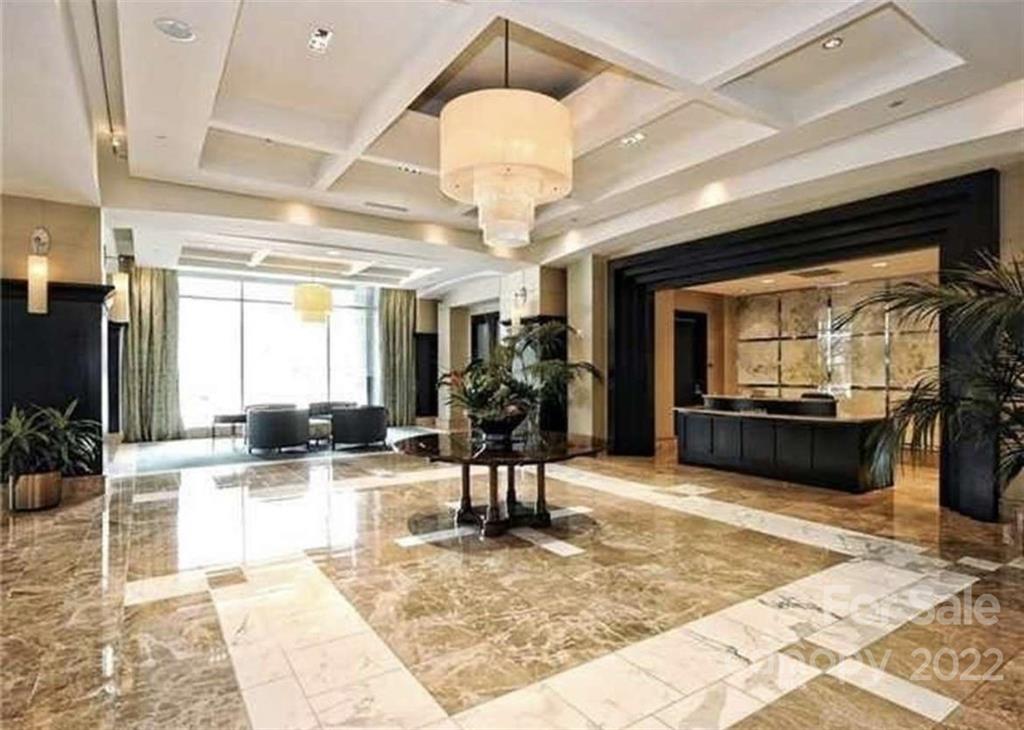 a view of a lobby with a couch and furniture