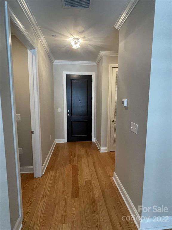 230 South Tryon Street, Unit 508 Charlotte, NC 28202 - Photo 15 of 24 a view of hallway with wooden floor