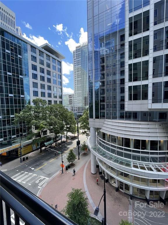 230 South Tryon Street, Unit 508 Charlotte, NC 28202 - Photo 19 of 24 a view of a balcony with chairs