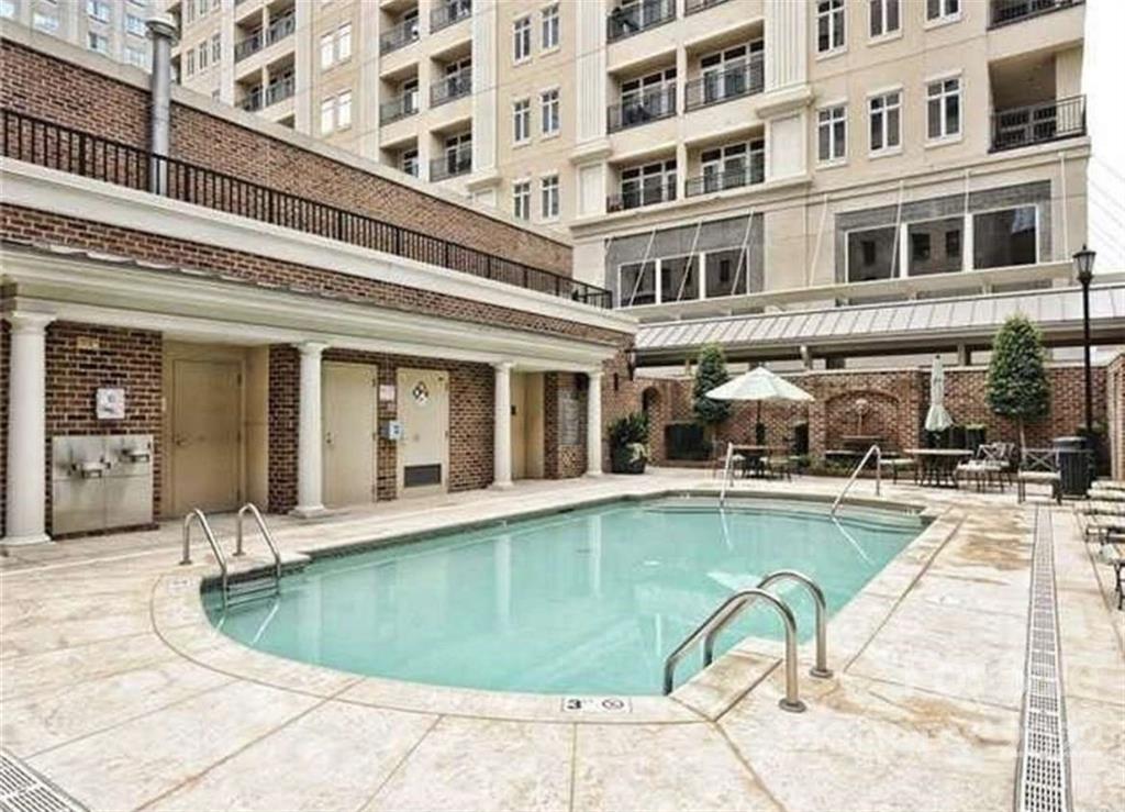 230 South Tryon Street, Unit 508 Charlotte, NC 28202 - Photo 2 of 24 a view of a swimming pool with a lounge chair