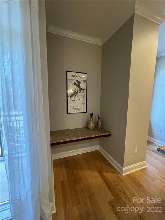 230 South Tryon Street, Unit 508 Charlotte, NC 28202 - Photo 5 of 24 a view of an empty room with wooden floor and a window