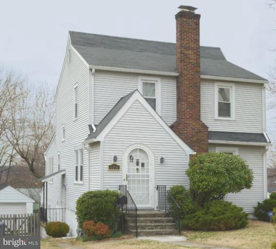 6216 Tramore Road Baltimore, MD 21214 - Photo 1 of 30 a front view of a house with garden