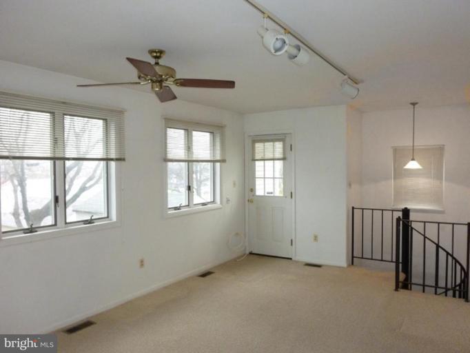 6216 Tramore Road Baltimore, MD 21214 - Photo 19 of 30 a view of empty room with windows