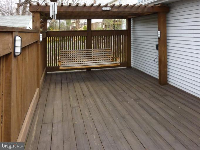 6216 Tramore Road Baltimore, MD 21214 - Photo 4 of 30 a view of a balcony with wooden floor
