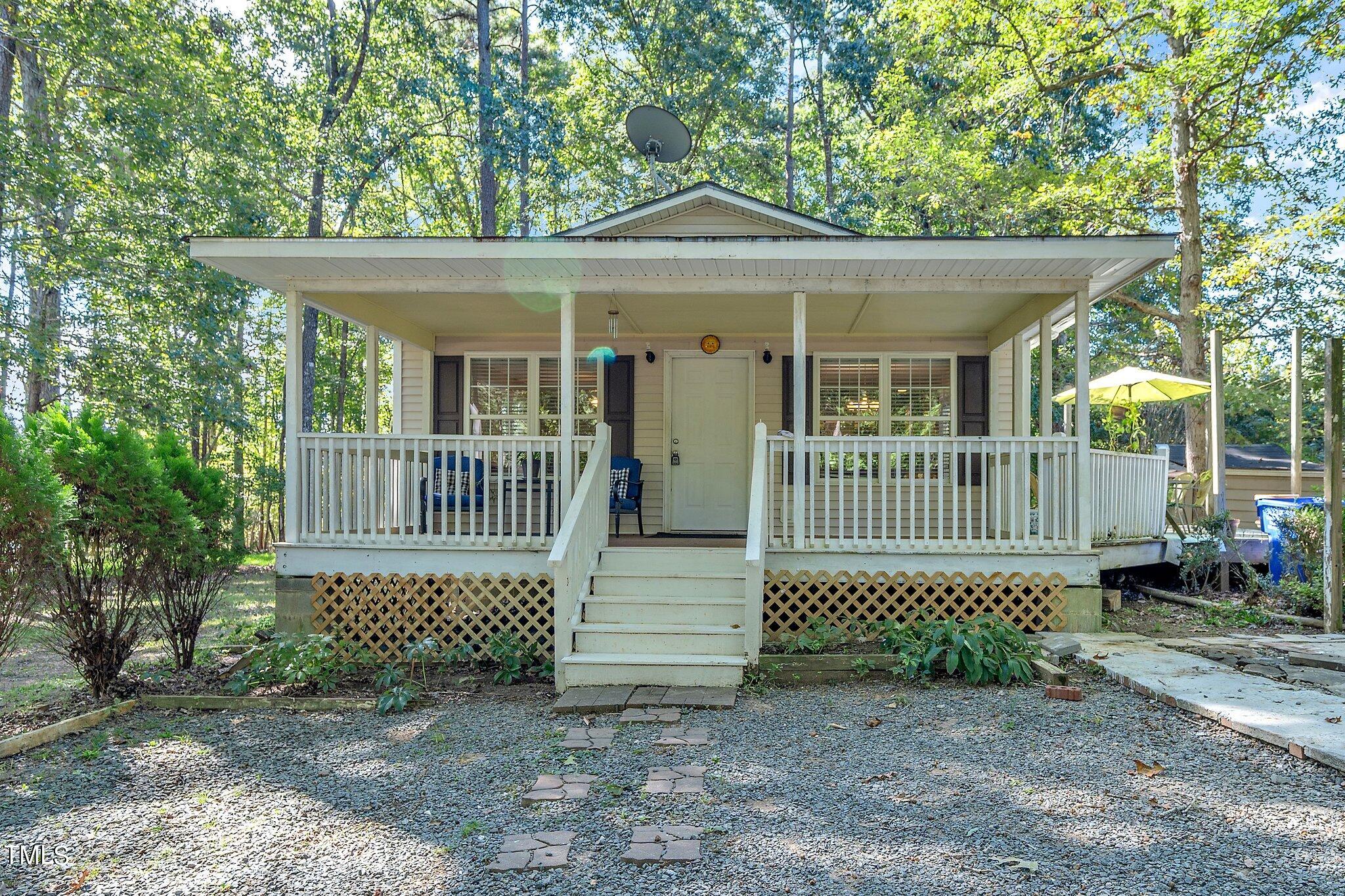 2514 Gemena Road Chapel Hill, NC 27516 - Photo 1 of 21 a view of a house with a small yard