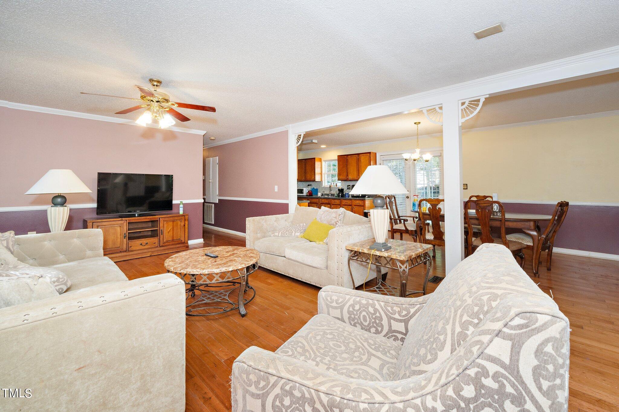 2514 Gemena Road Chapel Hill, NC 27516 - Photo 11 of 21 a living room with furniture and a flat screen tv