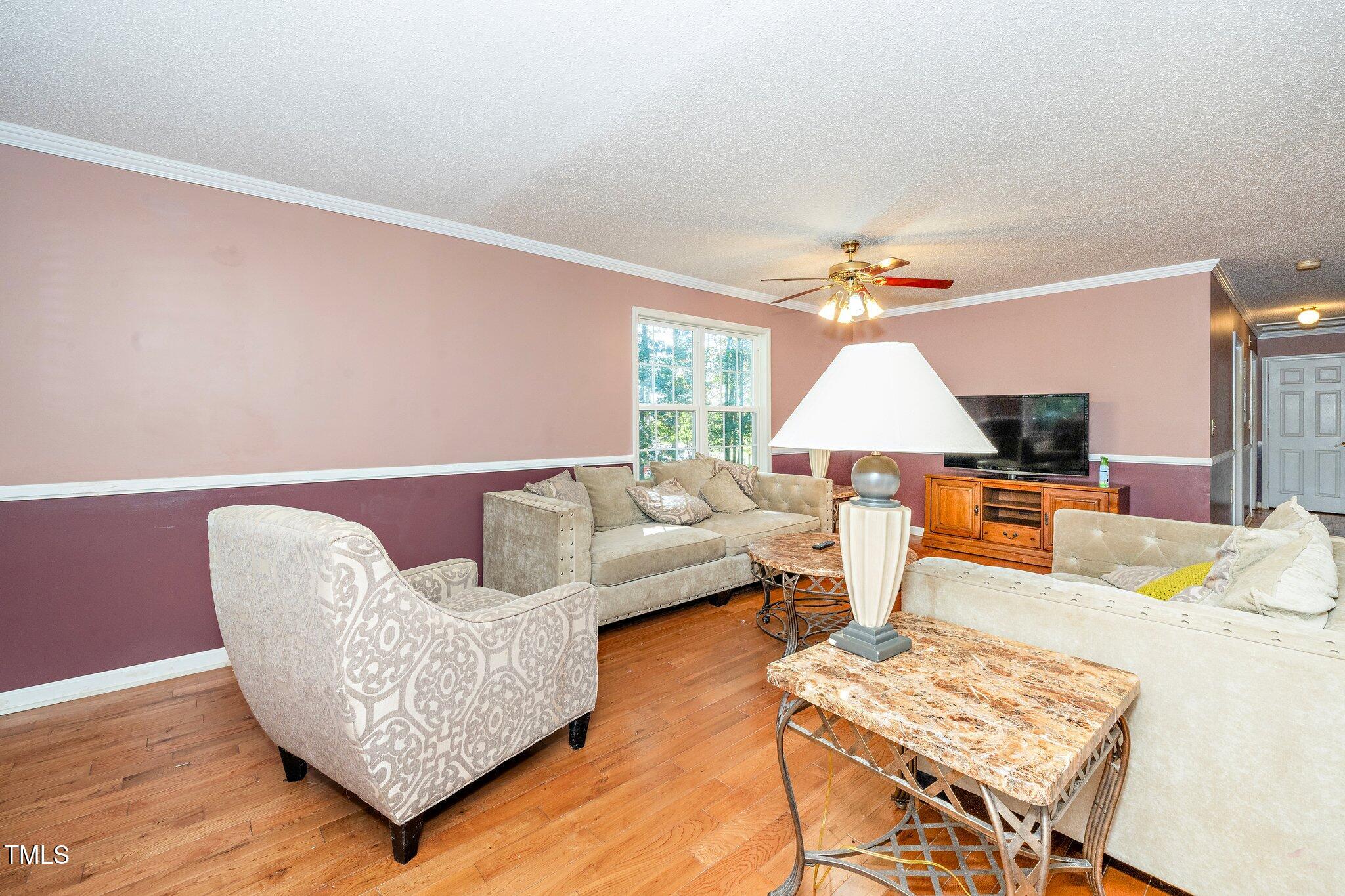 2514 Gemena Road Chapel Hill, NC 27516 - Photo 12 of 21 a living room with furniture and wooden floor