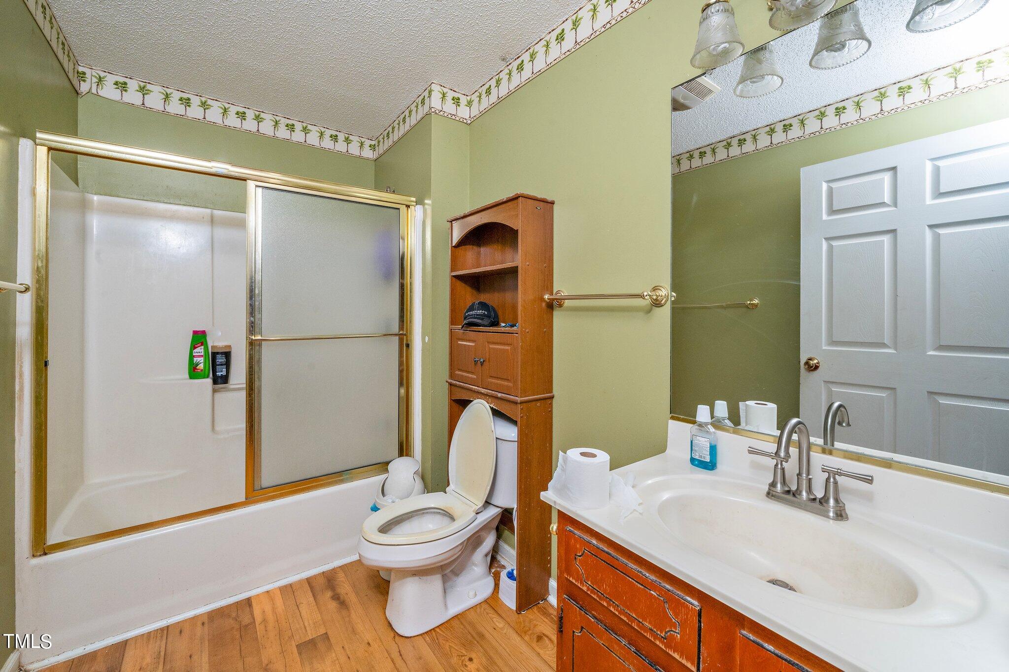 2514 Gemena Road Chapel Hill, NC 27516 - Photo 15 of 21 a bathroom with a sink a toilet and shower
