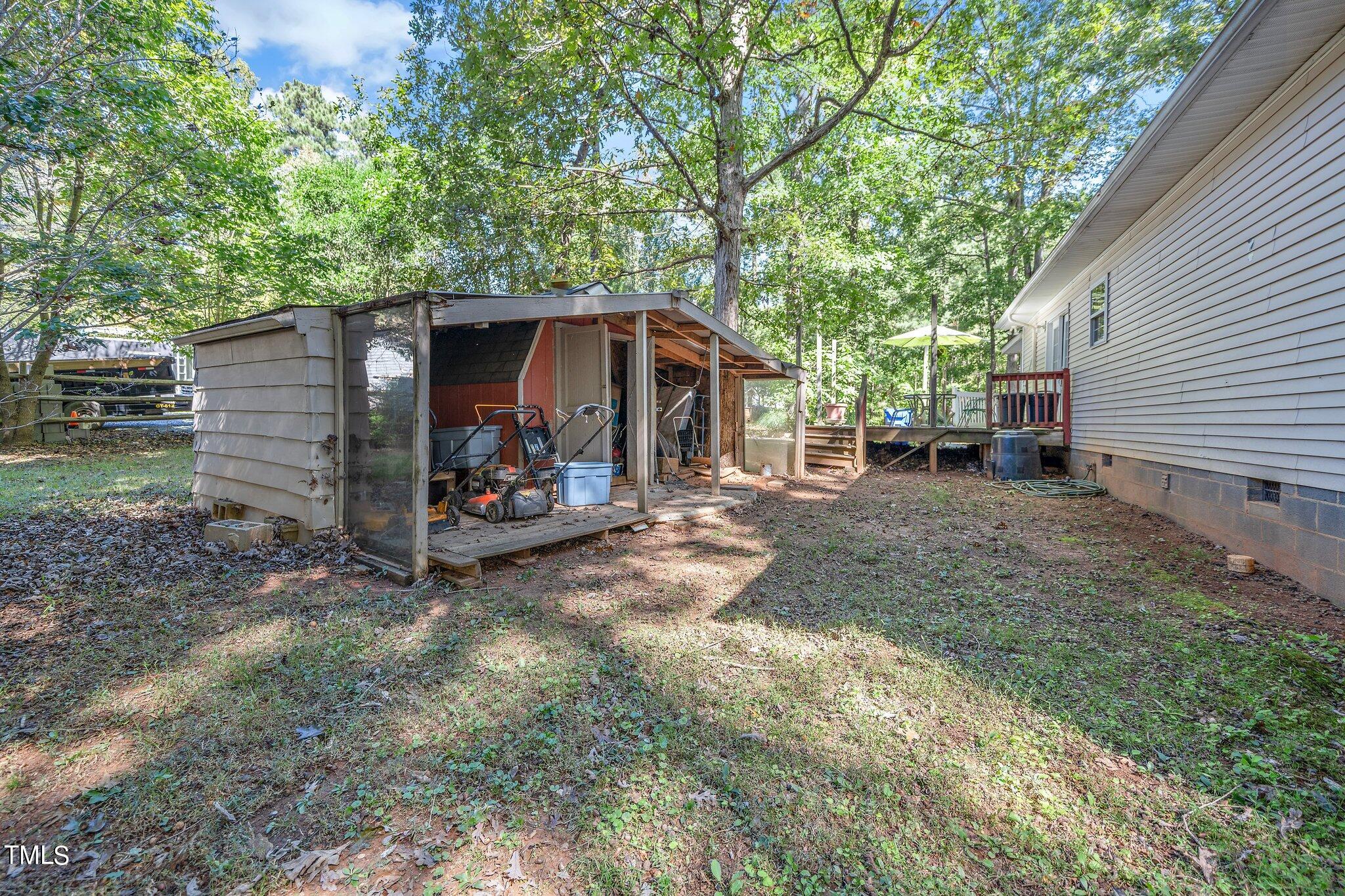 2514 Gemena Road Chapel Hill, NC 27516 - Photo 17 of 21 a view of a house with a large tree and a yard